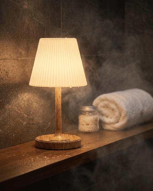 AquaGlow cordless waterproof table lamp with natural wood base glowing warm white