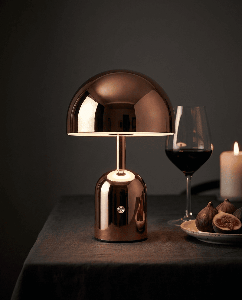MidasGlow glowing on a nightstand in a dark bedroom